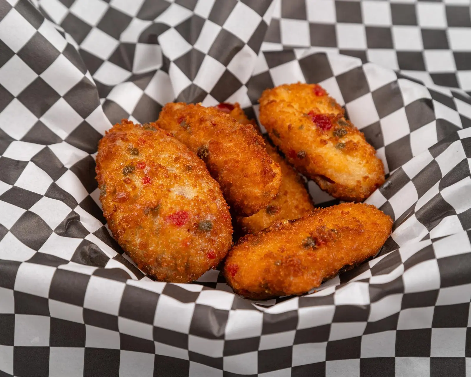 Jalapeno poppers served with dipping sauce at Wing Crafters in London, ON