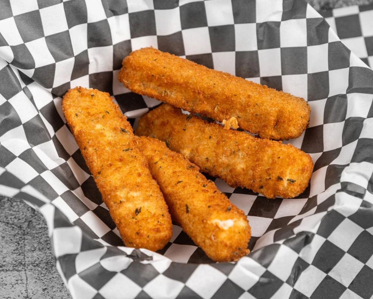 Mozzarella sticks served with marinara sauce at Wing Crafters in London, ON